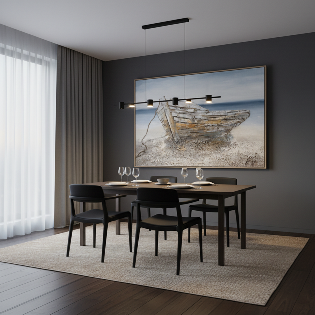 Dining room with a table set for four, black chairs, and a large framed artwork on the wall.