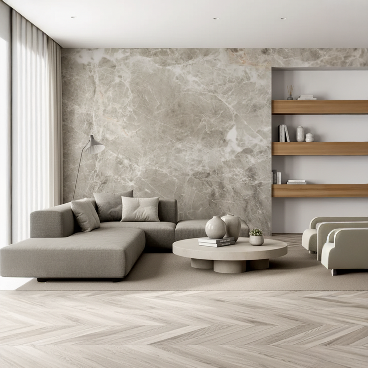 Modern living room with gray sectional sofa, wooden coffee table, and marble wallpaper.